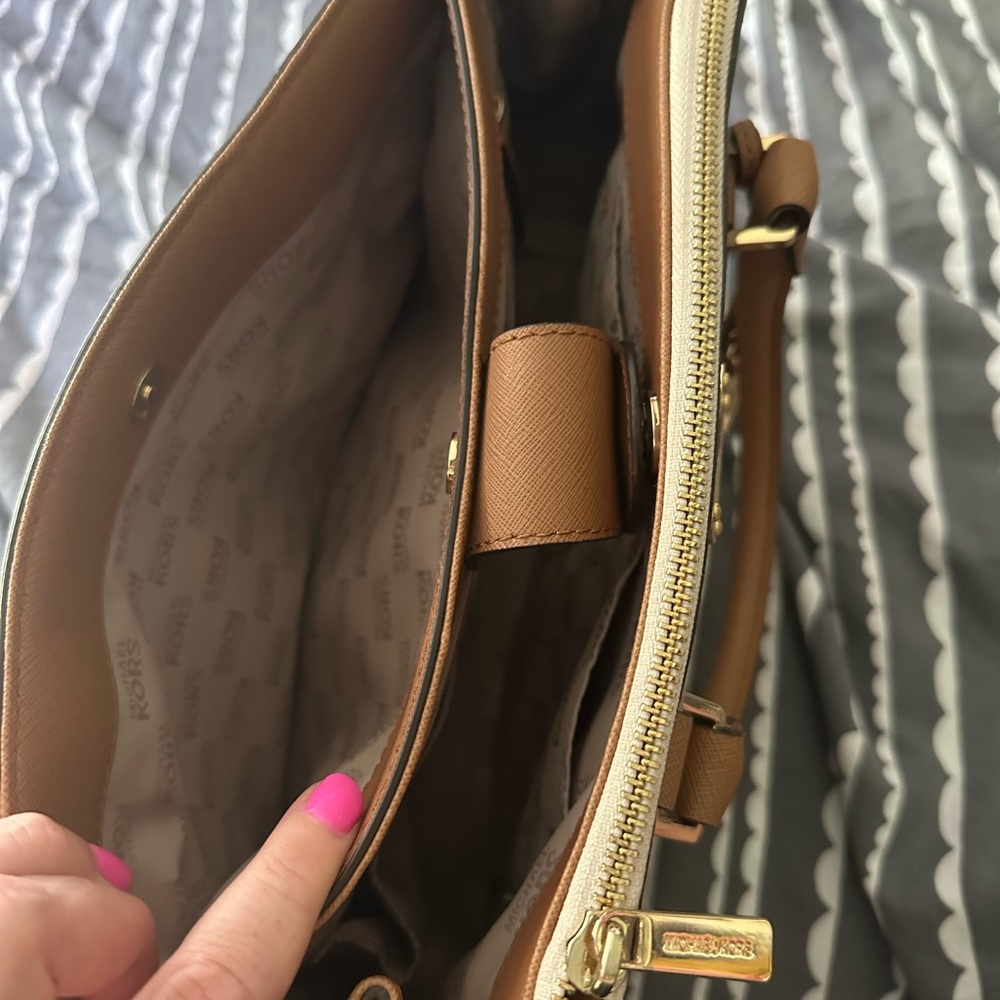 White and tan, Michael Kors’s handbag.